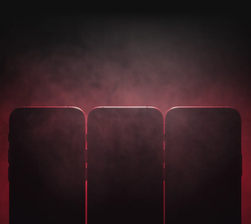 Drei Smartphones als Silhouette im rot beleuchteten Nebel – Teaser der Mobile Exclusive Community